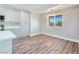 Bright kitchen with white cabinets, marble countertops, and wood-look floors at 3016 Mount Charleston Dr, Pahrump, NV 89048