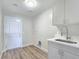 Convenient laundry room with modern white cabinets and sink at 3016 Mount Charleston Dr, Pahrump, NV 89048