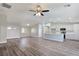 Spacious living room with modern flooring that connects to the kitchen at 3016 Mount Charleston Dr, Pahrump, NV 89048