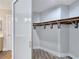 Spacious walk-in closet with ample shelving and wood-look floors at 3016 Mount Charleston Dr, Pahrump, NV 89048