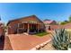 Backyard featuring a covered patio area with dining furniture at 312 Purple Passion Ave, North Las Vegas, NV 89032
