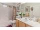 Bathroom boasts a bathtub, shower, vanity, and stylish decor at 312 Purple Passion Ave, North Las Vegas, NV 89032
