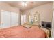 This is a spacious bedroom featuring neutral walls, a closet and an open doorway at 312 Purple Passion Ave, North Las Vegas, NV 89032