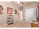 Neutral bedroom with a ceiling fan, closet and a desk with a computer on it at 312 Purple Passion Ave, North Las Vegas, NV 89032