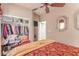 Bedroom featuring a full closet and a small television at 312 Purple Passion Ave, North Las Vegas, NV 89032