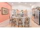 Bright kitchen with stainless steel appliances, granite counters, and large center island with barstool seating at 312 Purple Passion Ave, North Las Vegas, NV 89032