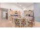 Spacious kitchen featuring granite countertops, a center island with seating, and stainless-steel appliances at 312 Purple Passion Ave, North Las Vegas, NV 89032