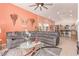 Spacious living room boasts a comfortable sectional sofa, high ceilings, and an open-concept layout at 312 Purple Passion Ave, North Las Vegas, NV 89032