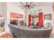 Inviting living room features a fireplace, stylish decor, and sliding door access to the outdoor patio at 312 Purple Passion Ave, North Las Vegas, NV 89032