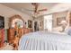 Comfortable main bedroom with ornate furniture, ceiling fan, and coordinated decor at 312 Purple Passion Ave, North Las Vegas, NV 89032