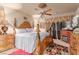 Luxurious main bedroom featuring a four-poster bed, elegant furnishings, and a cozy ambiance at 312 Purple Passion Ave, North Las Vegas, NV 89032