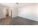 Well-lit bedroom space with neutral walls, wood flooring and a view to the closet at 3151 Soaring Gulls Dr # 1021, Las Vegas, NV 89128