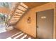 Condo unit entrance featuring the apartment number with stairway access at 3151 Soaring Gulls Dr # 1021, Las Vegas, NV 89128