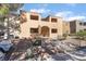 Condominium exterior view with a staircase and landscaped grounds with car parking spaces at 3151 Soaring Gulls Dr # 1021, Las Vegas, NV 89128