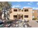 Exterior of a condo building that has landscaping and stairs with a railing for access at 3151 Soaring Gulls Dr # 1021, Las Vegas, NV 89128