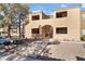 Inviting condo exterior with stairs leading to the second level, and a well-maintained landscape at 3151 Soaring Gulls Dr # 1021, Las Vegas, NV 89128