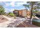 Apartment building exterior showcasing a landscaped yard, covered parking, and a well-maintained sidewalk at 3151 Soaring Gulls Dr # 1021, Las Vegas, NV 89128