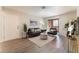 Inviting living room with dark gray sofas, neutral rug, and sliding glass doors at 3151 Soaring Gulls Dr # 1021, Las Vegas, NV 89128