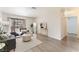 Bright living area with sliding glass door, neutral decor, and hardwood floors at 3151 Soaring Gulls Dr # 1021, Las Vegas, NV 89128