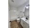 Updated bathroom features modern vanity, black hardware, and shower-tub combo at 3318 Covey Ln, Las Vegas, NV 89115