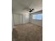 This bedroom features carpet and two large closets at 3318 Covey Ln, Las Vegas, NV 89115