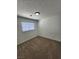 This bedroom features carpet and a window at 3318 Covey Ln, Las Vegas, NV 89115