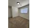 This bedroom features carpet and a large closet at 3318 Covey Ln, Las Vegas, NV 89115