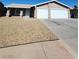 Charming single-story home with a two-car garage, low-maintenance landscaping, and a welcoming entrance at 3318 Covey Ln, Las Vegas, NV 89115