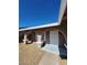 Covered front porch with arched openings and seating, creating an inviting outdoor space at 3318 Covey Ln, Las Vegas, NV 89115