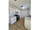 Updated kitchen featuring white cabinets, sleek countertops, and modern appliances, including a gas range at 3318 Covey Ln, Las Vegas, NV 89115