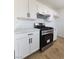 Modern kitchen with white cabinets, stainless steel appliances, and stylish hardware for a contemporary look at 3318 Covey Ln, Las Vegas, NV 89115