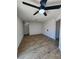 The living room features a ceiling fan and wood floors at 3318 Covey Ln, Las Vegas, NV 89115