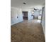 Bright living room with wood-look floors, neutral paint, and open layout into the kitchen area at 3318 Covey Ln, Las Vegas, NV 89115