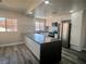 Renovated kitchen boasting stainless steel appliances, a center island, and wood flooring at 3327 Erva St # 222, Las Vegas, NV 89117