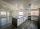 Spacious open floor plan featuring kitchen island and updated appliances at 3327 Erva St # 222, Las Vegas, NV 89117