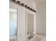Bright bathroom with a decorative light fixture above a mirror and a vanity at 3439 Cox St, North Las Vegas, NV 89032
