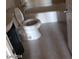 Bright bathroom featuring a white toilet, tub and sink with grey tile flooring at 3439 Cox St, North Las Vegas, NV 89032