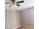 Bedroom with hardwood floors, ceiling fan, and neutral-colored walls at 3439 Cox St, North Las Vegas, NV 89032