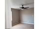 Bedroom with hardwood floors, neutral walls, and a ceiling fan with lighting at 3439 Cox St, North Las Vegas, NV 89032