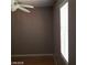 Neutral bedroom with ceiling fan, hardwood floors, and a window with white blinds at 3439 Cox St, North Las Vegas, NV 89032