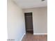 Small walk-in closet with hardwood floors and a hanging rack at 3439 Cox St, North Las Vegas, NV 89032