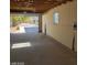 Spacious garage with an open door, high ceilings and ample room for parking and storage at 3439 Cox St, North Las Vegas, NV 89032