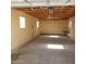 Large garage with high ceiling, lighting, and windows at 3439 Cox St, North Las Vegas, NV 89032