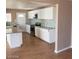 Modern kitchen with island, stainless steel appliances and tiled backsplash at 3439 Cox St, North Las Vegas, NV 89032