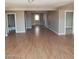 Spacious living area with hardwood floors that connect to other rooms at 3439 Cox St, North Las Vegas, NV 89032