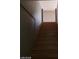 View of interior wooden stairs ascending from the first floor at 3439 Cox St, North Las Vegas, NV 89032