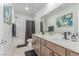 Neutral-toned bathroom with double sinks, updated fixtures, and a shower/tub combination at 360 Rosefinch St, Henderson, NV 89012