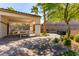 Shaded community picnic area with BBQ grills, picnic tables, mature trees, and well-maintained landscaping at 360 Rosefinch St, Henderson, NV 89012