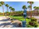 Well-maintained community dog park with lush grass, dog waste station, and walking paths at 360 Rosefinch St, Henderson, NV 89012