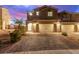 Charming two-story home featuring a brick driveway and a two-car garage at 360 Rosefinch St, Henderson, NV 89012